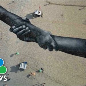 Artist Creates Giant Symbol Of Togetherness On Rio's Copacabana Beach